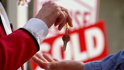 An elderly hand drops keys into an open hand. Stock Footage