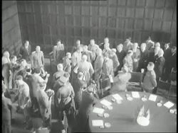 Soviet Premier Joseph Stalin, United States President Harry S. Truman, British Prime Minister Winston Churchill and officials stand in a large room at the Potsdam Conference in Germany. News Clip