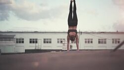 Young woman doing yoga exercise outside Stock Footage