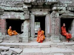 MS Three Monks in Saffron robes inside of temple  / Cambodia Stock Footage