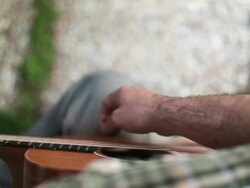 Acoustic guitarist playing chords, close-up Stock Footage