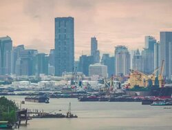 Large cargo ship are being loaded into small cargo ships Stock Footage