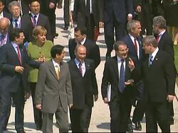 WRAP Lunch, spouses photo-op; ADDS Merkel on climate, working group News Clip