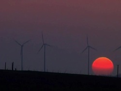 Windmills at sunset Stock Footage