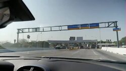 Driving shot from the US into Mexico News Clip