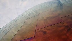 The Space Needle with the Experience Music Project museum and trees,clouds with sun behind it. Stock Footage