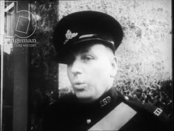 Police in Britain part 2 - women modelling dresses on a London street. Policemen and men watch them. 1960s. Stock Footage