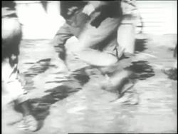 A man pans for gold during the Yukon gold rush of the 1850s. News Clip