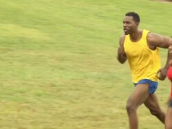 Male and Female Athletes Run Right to Left - WS Stock Footage