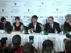 Sean Penn takes a drag from his cigarette and photographers take pictures at the press conference at the Cinema for Peace Press Conference: 61st Berlin International Film Festival at Berlin . (Footage by WireImage Video/GettyImages) Stock Footage