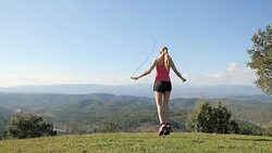Jumping rope in mountain Stock Footage