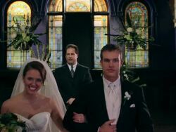 PULL Bride and groom walk toward camera as guests clap Stock Footage