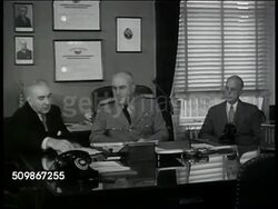 1947: U.S. TREASURY BUILDING: WS Building, traffic FG. INT VS Admiral Farley (unconfirmed) at desk talking w/ men (possibly Woolf & Mealy, unconfirmed), looking at paper. Alcohol Tax Unit, Intelligence Unit, Coast Guard, Washington D.C. Instructional Video