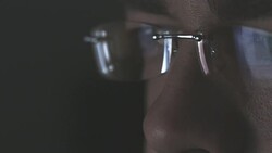 Male eyes looking at computer monitor Stock Footage