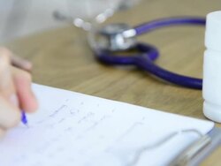 Doctor write prescription Stock Footage