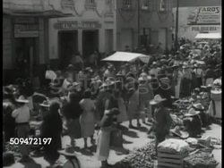 1935: MEXICO FOOD MARKET: HA WS Crowded Mexican food market. VS Mexicans shopping, crates of fruits, vegetables. Instructional Video
