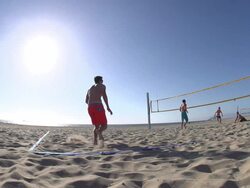 Men playing beach volleyball. - Slow Motion - filmed at 240 fps Stock Footage