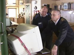 North West Passage Expedition Ship Captain checking weather reports News Clip