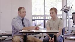 Male speech therapist working with teenage patient Stock Footage