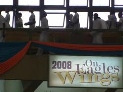 MS Shot of congregations leaving church with sign on wall 2008 On Eagles Wings / Lagos, Nigeria Stock Footage