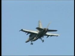 Small, inert training bomb falls from fighter jet News Clip