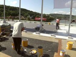 MS Shot of workermen painting on bridge at bridge construction / Wellen, river Moselle, Germany Stock Footage
