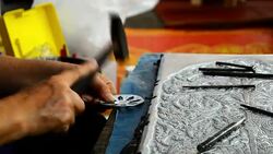 Silver art handicrafts of Lanna, Thai style, Chiang Mai, Thailand, hand banging on silver with a hammer. Stock Footage
