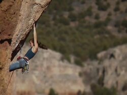 WS ZI TU Looking across to climber she struggles to make few difficult mvoes on  steep rocking face / Canon City / Shelf Road,CO,USA Stock Footage