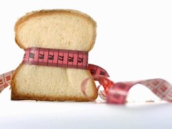 HD: White Bread Wrapped In Measuring Tape Stock Footage