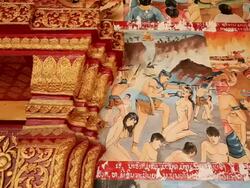 MS PAN Shot of colorful gory paintings on exterior Buddhist temple wall / Luang Prabang, Laos Stock Footage
