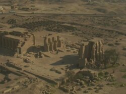 High Angle, aerial - Sandstone historical ruins with large pillars stand out in the Egyptian Nile Delta Stock Footage