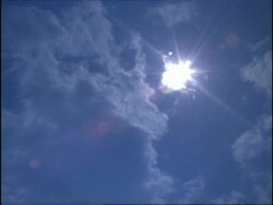 Sun & Clouds, white starburst sun, England Stock Footage