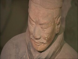 CU Terracotta Warrior face, zooms out to WA view of group of soldiers, Museum of Qin, Xian, China Stock Footage