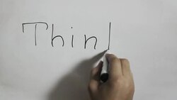 Hand writing a 'Think different' message on a white board using a black marker Stock Footage