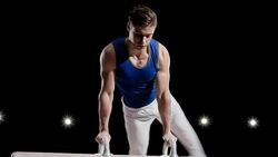 TU Male gymnast performing on pommel horse Stock Footage