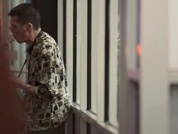 A man on a busy street corner playing the Saxophone at night near Time Square Stock Footage