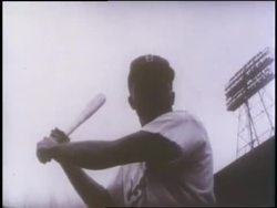 Fans cheer as Jackie Robinson plays baseball with the Brooklyn Dodgers. News Clip