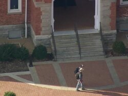 MS AERIAL Shot of student walking through passage of clemson university / South Carolina, United States Stock Footage