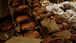 At the bakery. Rows of fresh, puffy challah Stock Footage
