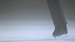 SLO MO TU Figure skater in scratch spin Stock Footage