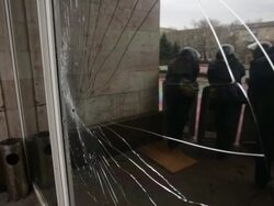 Bullet hole in front window of police protected government building Donetsk Stock Footage