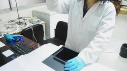 Scientists women consider sample after using uv visible spectroscopy Stock Footage