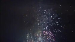Fireworks burst in a smokey sky. Stock Footage