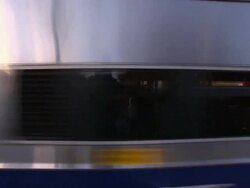 A New York City Transit Authority train speeds through the Hastings on Hudson Metro North Station. Stock Footage