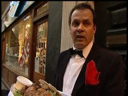 A British performance artist staged a bizarre protest against the royal family on Tuesday - by eating a dead dog in the middle of a busy street in London. News Clip