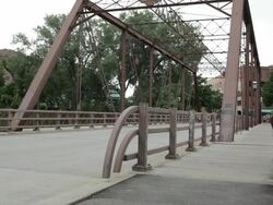 WS Two young girls running on bridge / Minneapolis, Minnesota, United States Stock Footage