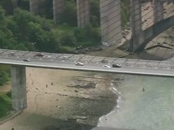MS AERIAL ZO Shot of cars running on bridge crossing sea in city Brest (no closer- military) / Brittany, France Stock Footage