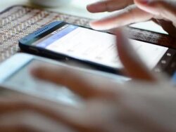 Businesswoman playing mobile phone. Stock Footage