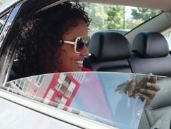 MS Young girl using cell phone in backseat of car smiling and having fun / Minneapolis, Minnesota, United States Stock Footage