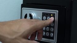 Men hands unlocking combination to safe in the hotel room Stock Footage